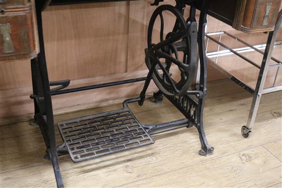 An Excelsior sewing machine within table W.95cm